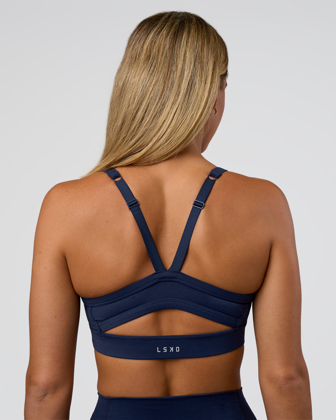 Woman wearing Momentum Sports Bra - Future Navy | Model:Amity | Size:S - view 2