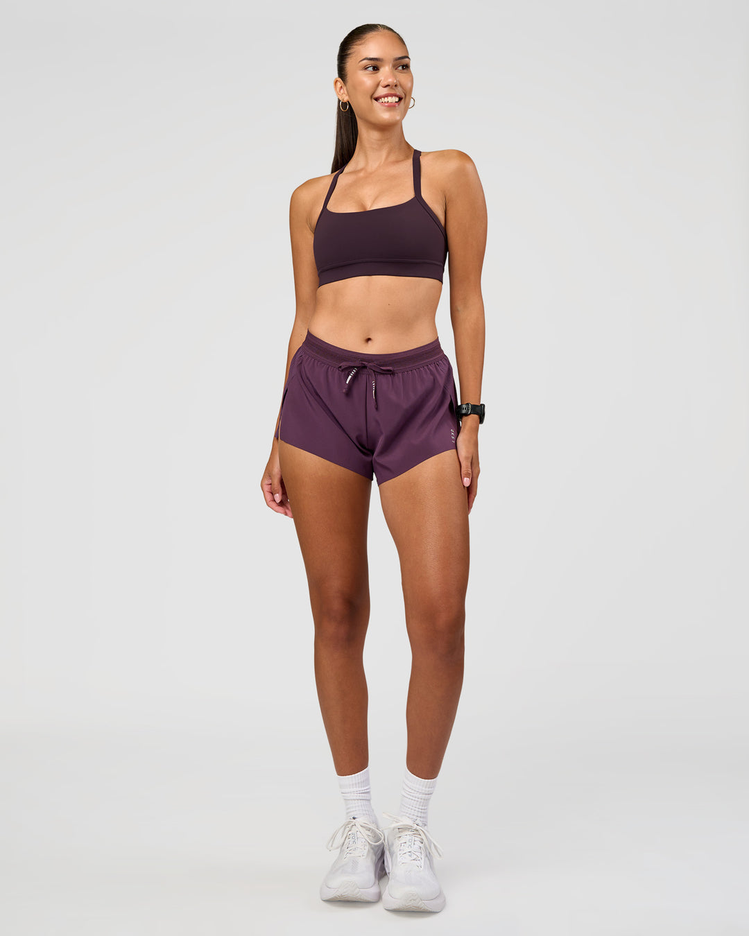 Woman wearing Momentum Sports Bra - Midnight Plum | Model:Rhiley | Size:S - view 7