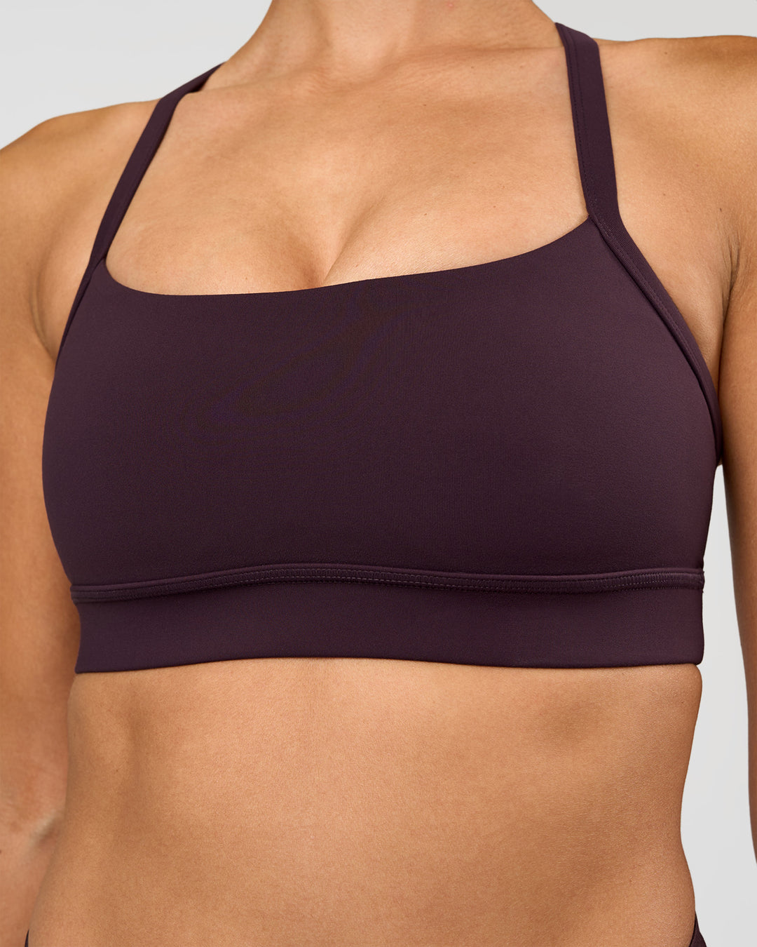 Woman wearing Momentum Sports Bra - Midnight Plum | Model:Rhiley | Size:S - view 4