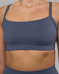 Woman wearing Momentum Sports Bra - Night Shadow | Model:Phoebe | Size:S | Thumbnail Index: 3