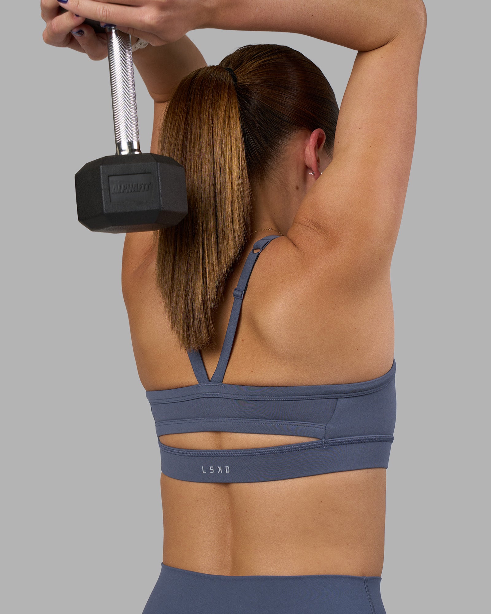 Woman wearing Momentum Sports Bra - Night Shadow | Model:Phoebe | Size:S