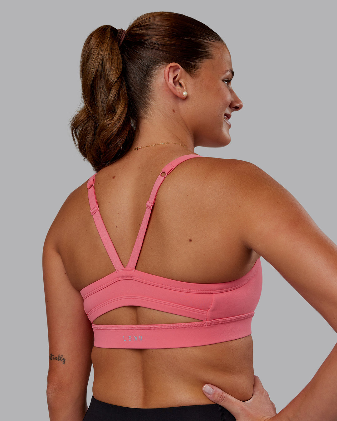 Woman wearing Momentum Sports Bra - Pink Lemonade | Model:Phoebe | Size:S - view 2
