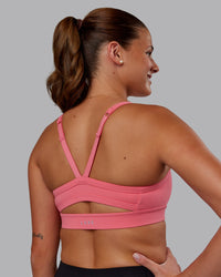 Woman wearing Momentum Sports Bra - Pink Lemonade | Model:Phoebe | Size:S | Thumbnail Index: 1