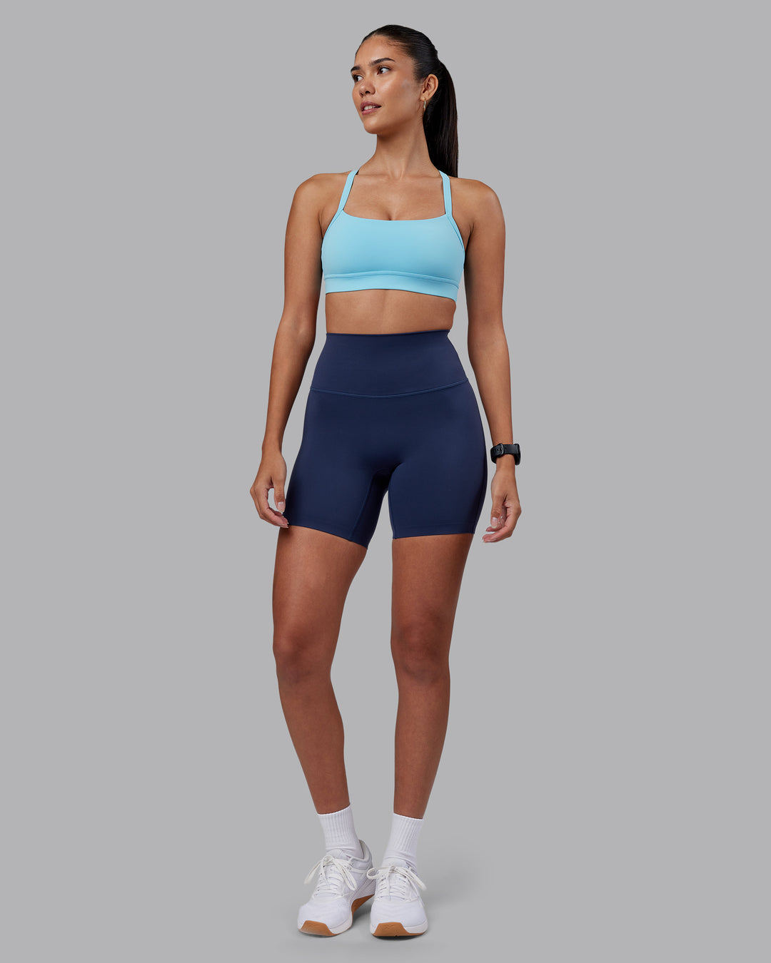 Woman wearing Momentum Sports Bra - Sky Blue | Model:Rhiley | Size:S - view 5