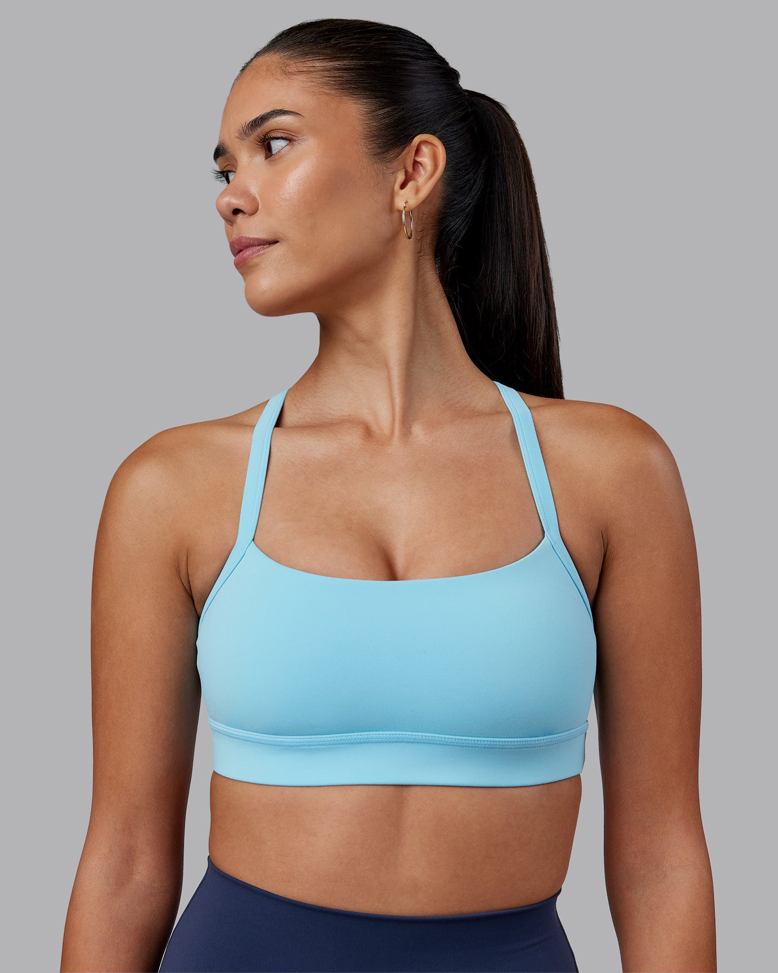 Woman wearing Momentum Sports Bra - Sky Blue | Model:Rhiley | Size:S