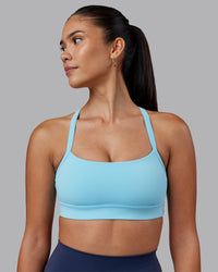 Woman wearing Momentum Sports Bra - Sky Blue | Model:Rhiley | Size:S | Thumbnail Index: 0