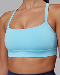 Woman wearing Momentum Sports Bra - Sky Blue | Model:Rhiley | Size:S | Thumbnail Index: 3