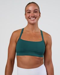 Woman wearing Momentum Sports Bra - Transformative Teal | Model:Sav | Size:S | Thumbnail Index: 3