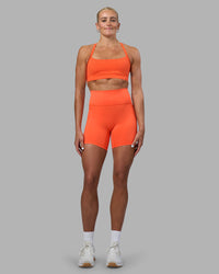 Woman wearing Momentum Sports Bra - Ultra Orange | Model:Katie | Size:S | Thumbnail Index: 2