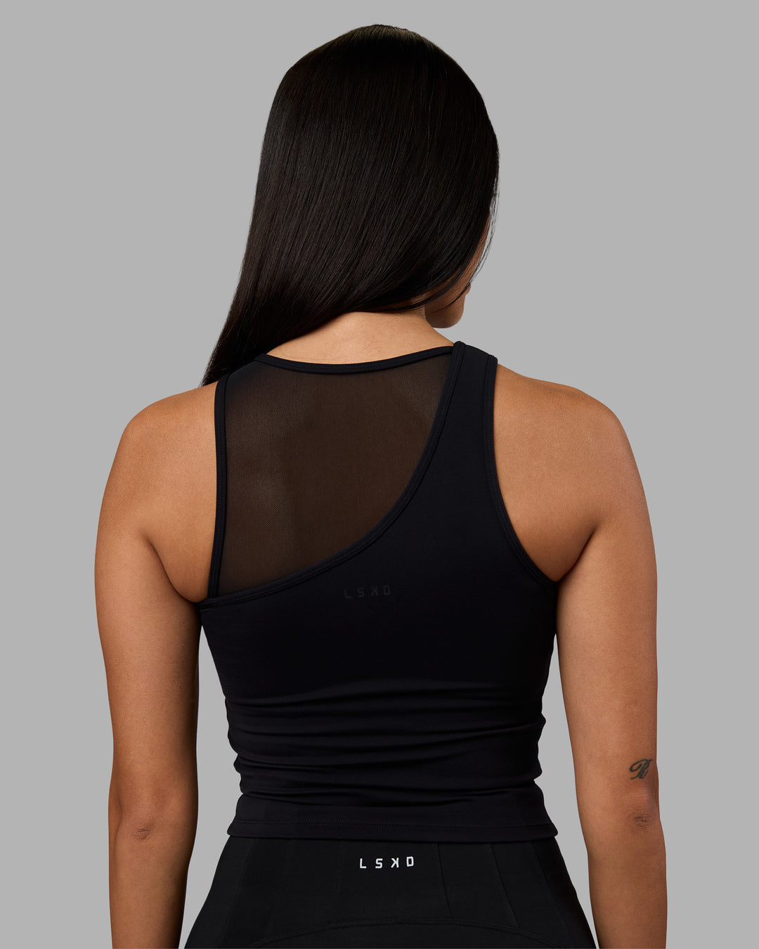 Woman wearing Motion Mesh Shelf Bra Tank - Black | Model:Rhiley | Size:S - view 4