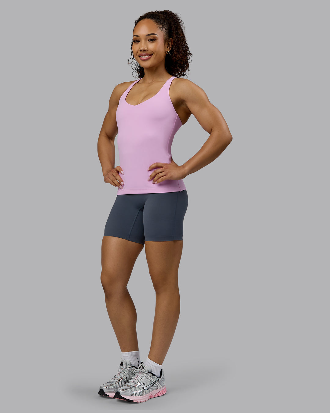 Woman wearing Movement Longline Active Shelf Bra Tank - Pastel Orchid - view 5