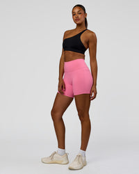 Woman wearing Muse Asymmetric Sports bra - Black | Model:Rosie | Size:S | Thumbnail Index: 4
