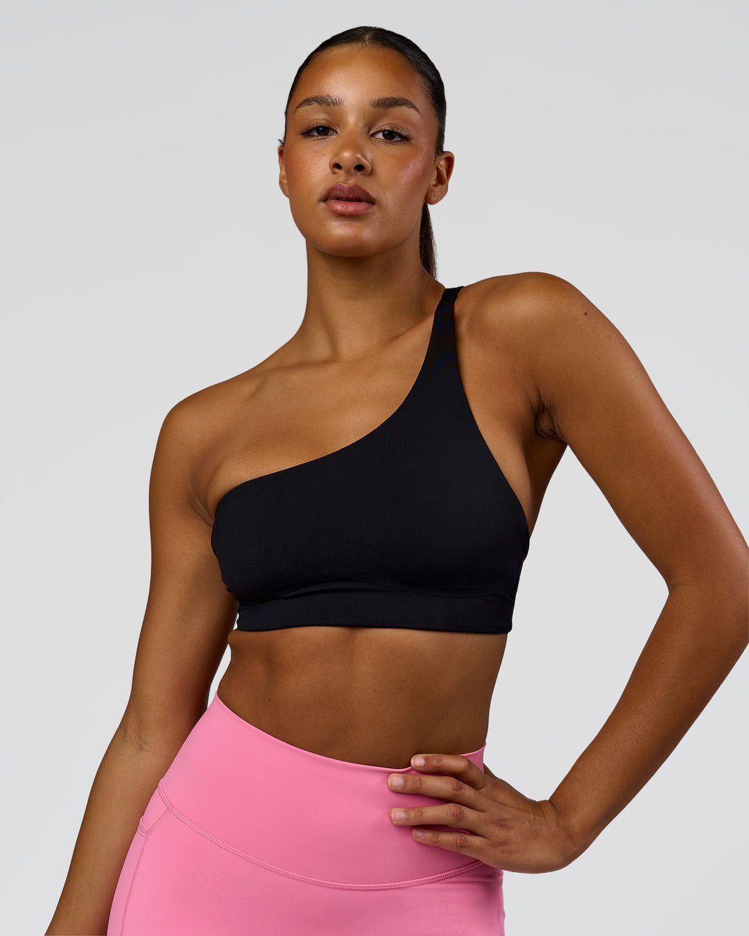 Woman wearing Muse Asymmetric Sports bra - Black | Model:Rosie | Size:S - view 6