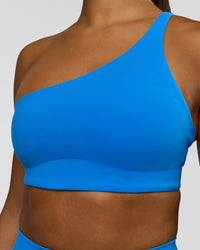 Woman wearing Muse Asymmetric Sports bra - Palace Blue | Model:Rosie | Size:S | Thumbnail Index: 5