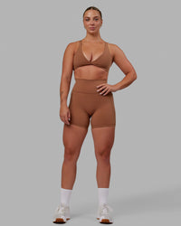 Woman wearing Nimble Sports Bra - Brick | Thumbnail Index: 9