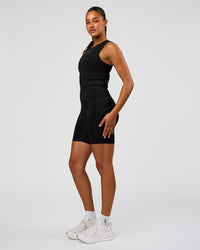 Woman wearing NyxRun Stash Tank - Black | Model:Rosie | Size:S | Thumbnail Index: 6