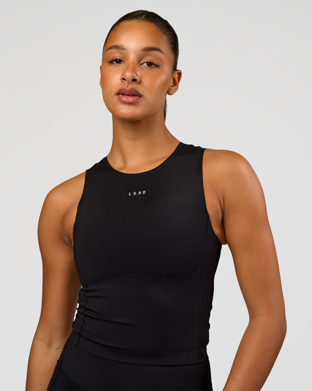 Woman wearing NyxRun Stash Tank - Black | Model:Rosie | Size:S - view 6