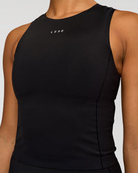 Woman wearing NyxRun Stash Tank - Black | Model:Rosie | Size:S | Thumbnail Index: 2