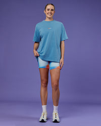 Woman wearing Our Journey Heavyweight Oversized Tee - Azure Blue-Rainbow | Model:Mon | Size:S | Thumbnail Index: 5