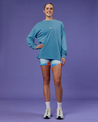 Woman wearing Our Journey Oversize Heavyweight FLXCotton Long Sleeve Tee - Azure Blue | Model:Mon | Size:S | Thumbnail Index: 10