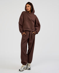 Woman wearing Post Train Hoodie - Hot Chocolate | Model:Ruby | Size:S | Thumbnail Index: 1