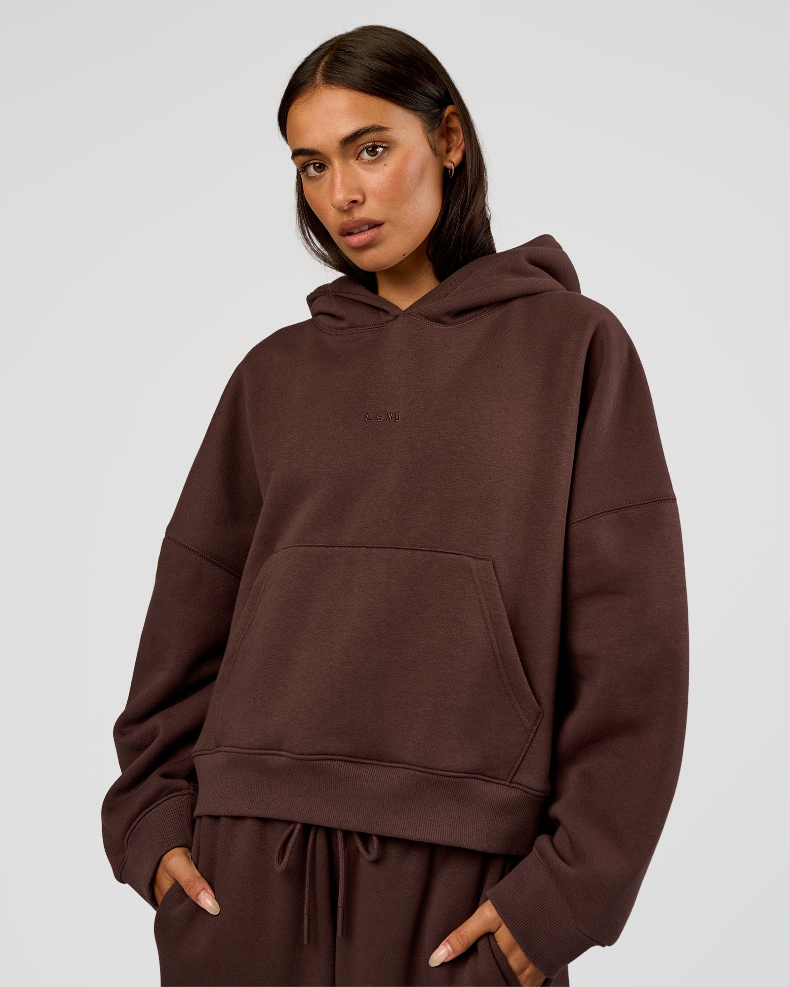 Woman wearing Post Train Hoodie - Hot Chocolate | Model:Ruby | Size:S