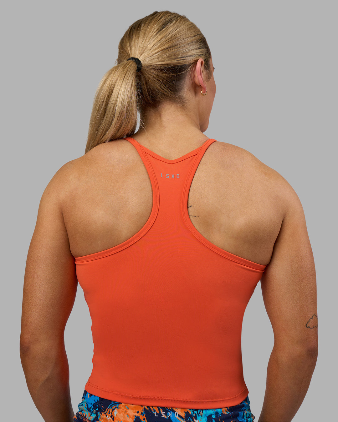 Woman wearing Power Performance Tank - Ultra Orange | Model:Georgia | Size:S - view 3