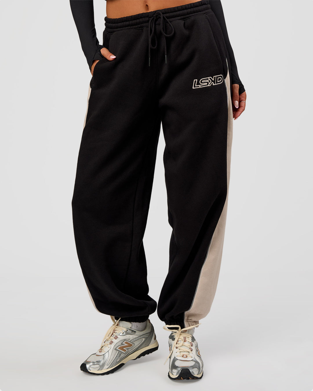 Woman wearing Power Play Stitch Up Fleece Sweat Pant - Black-Shale Beige | Model:Bianca | Size:S - view 1
