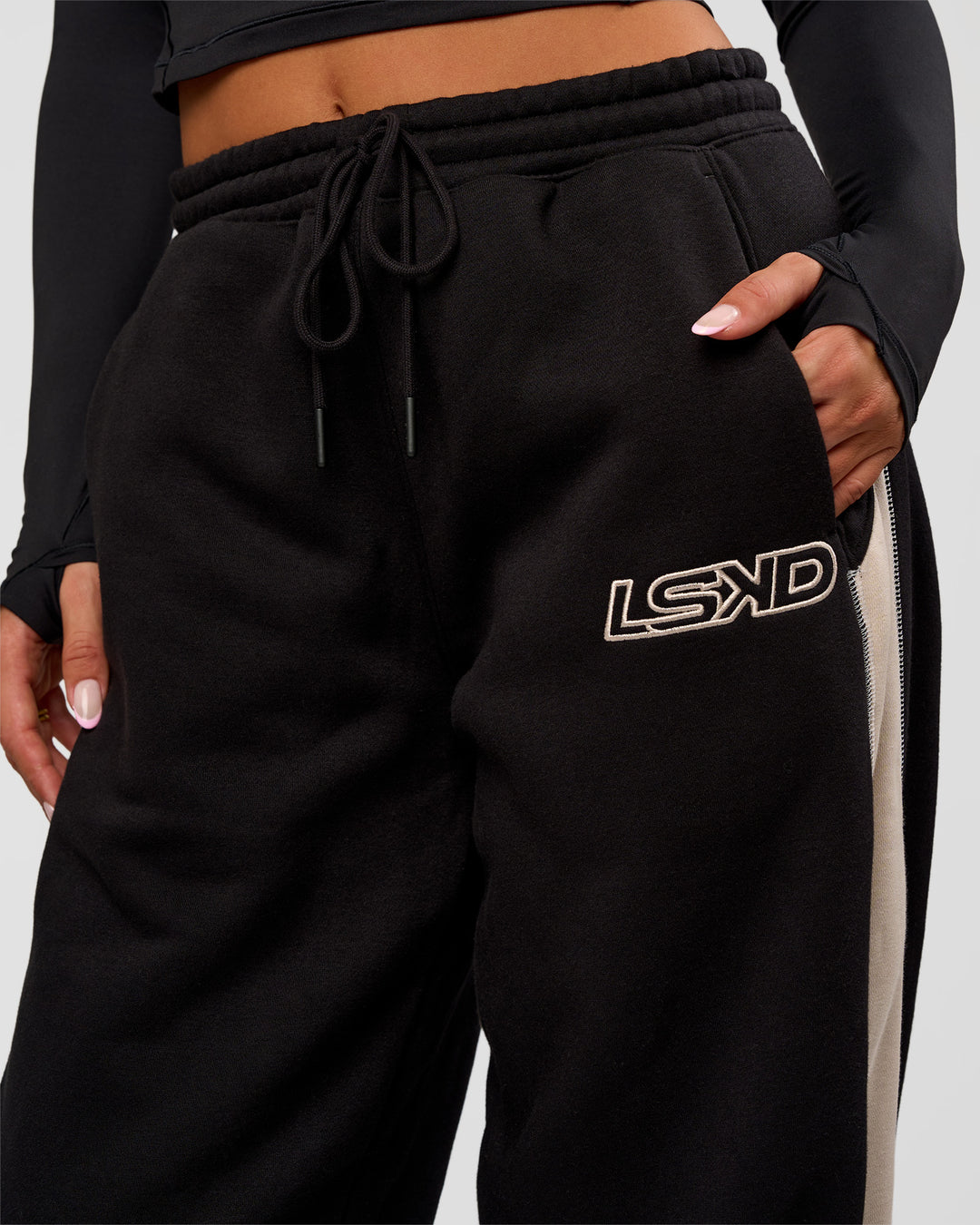 Woman wearing Power Play Stitch Up Fleece Sweat Pant - Black-Shale Beige | Model:Bianca | Size:S - view 8