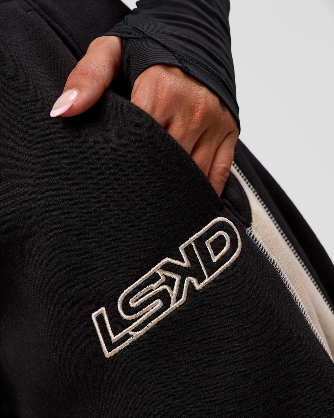 Woman wearing Power Play Stitch Up Fleece Sweat Pant - Black-Shale Beige | Model:Bianca | Size:S - view 6