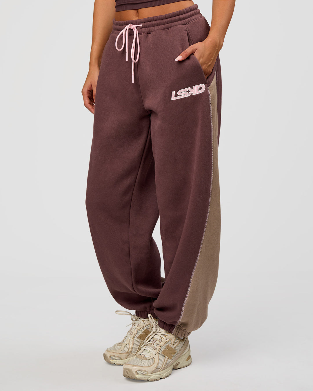 Woman wearing Power Play Stitch Up Fleece Sweat Pant - Cocoa Powder-Marshmallow | Model:Bianca | Size:S - view 1