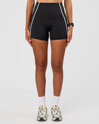 Woman wearing Power Ultra High-Rise 4" Short Pockets - Black | Model:Rhiley | Size:S | Thumbnail Index: 0
