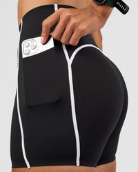 Woman wearing Power Ultra High-Rise 4" Short Pockets - Black | Model:Rhiley | Size:S | Thumbnail Index: 3