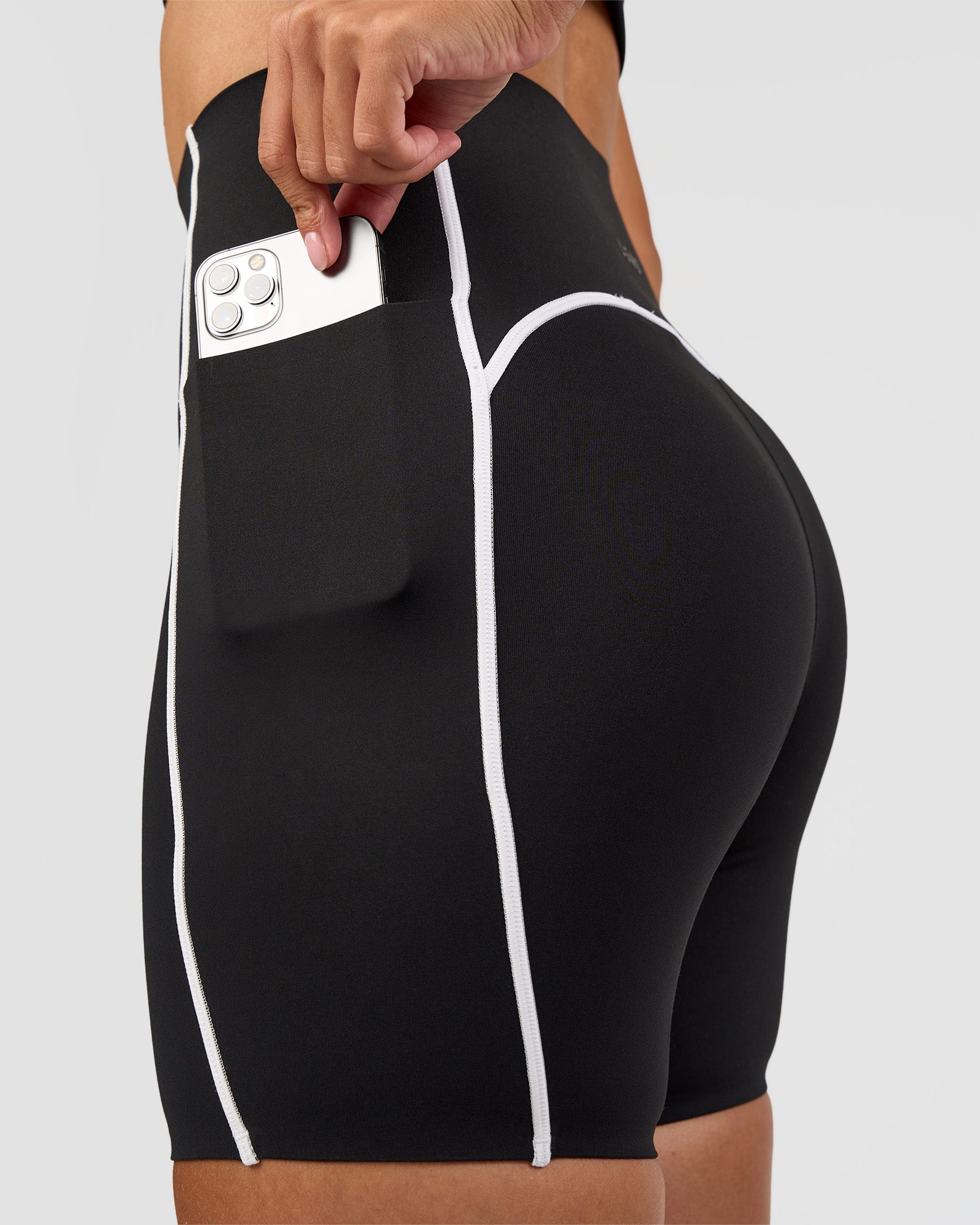 Woman wearing Power Ultra High-Rise 6" Short Pockets - Black | Model:Rhiley | Size:S