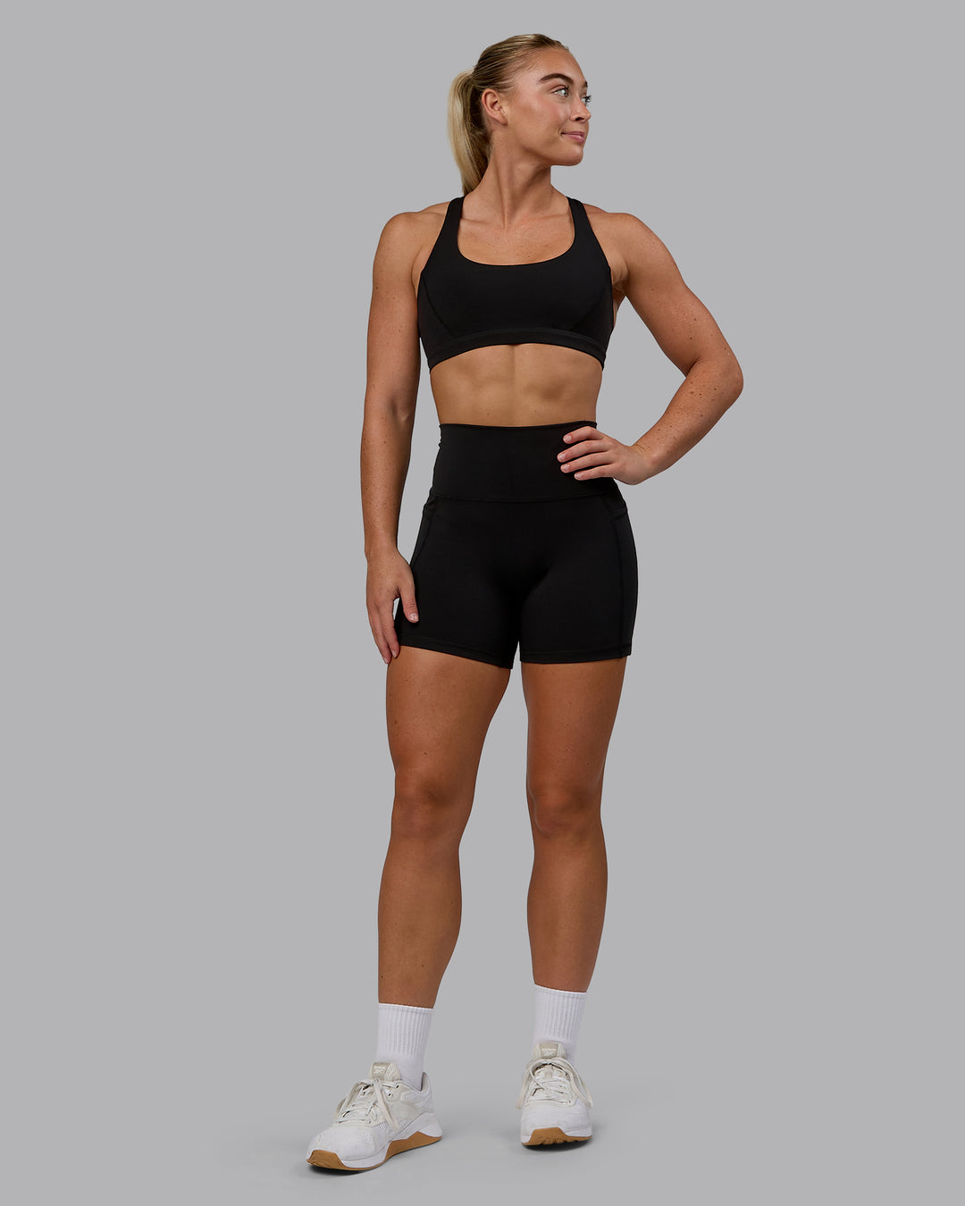 Woman wearing Precision Sports Bra - Black - view 5