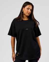 Woman wearing Pride Sticker Boxy Tee - Black | Model:Bianca | Size:S | Thumbnail Index: 12