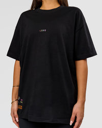 Woman wearing Pride Sticker Boxy Tee - Black | Model:Bianca | Size:S | Thumbnail Index: 16