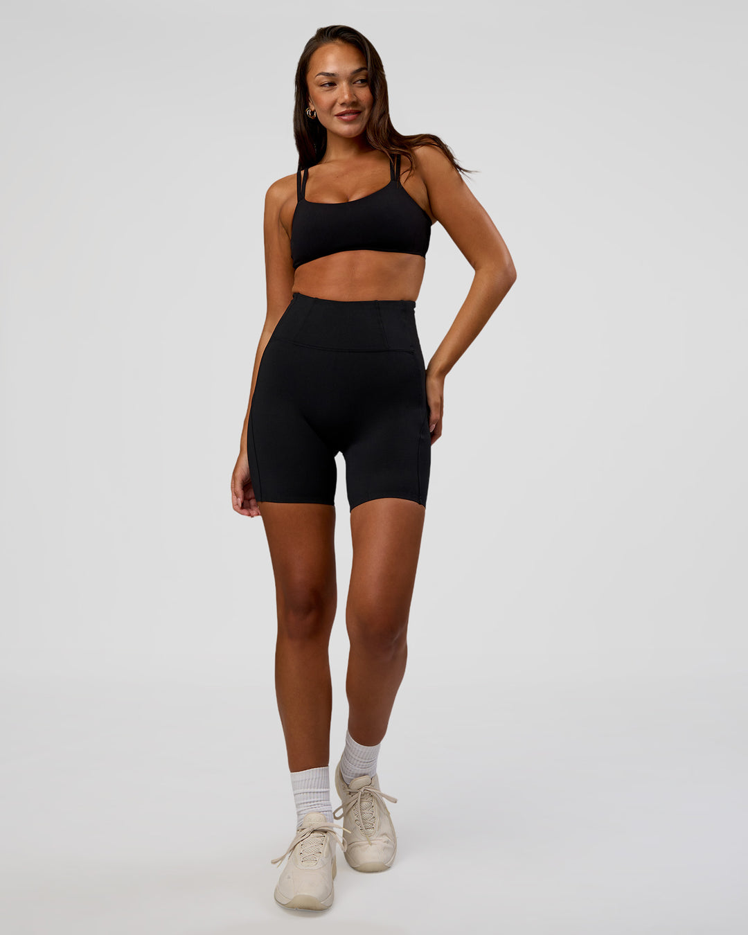 Woman wearing Progression Ultra High-Rise 6" Short - Black | Model:Kirstyn | Size:S - view 3