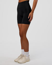 Woman wearing Progression Ultra High-Rise 6" Short - Black | Model:Kirstyn | Size:S | Thumbnail Index: 0