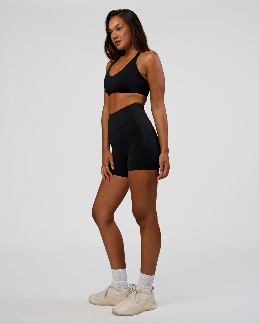 Woman wearing Progression Ultra High-Rise 4" Short - Black | Model:Kirstyn | Size:S - view 5