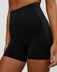 Woman wearing Progression Ultra High-Rise 4" Short - Black | Model:Kirstyn | Size:S | Thumbnail Index: 0