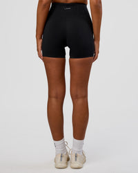 Woman wearing Progression Ultra High-Rise 4" Short - Black | Model:Kirstyn | Size:S | Thumbnail Index: 3