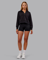 Woman wearing Pursue Mid-Weight Hoodie - Black | Model:Ella | Size:S | Thumbnail Index: 4