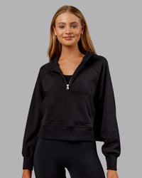 Woman wearing Pursue Mid-Weight Hoodie - Black | Model:Ella | Size:S | Thumbnail Index: 0