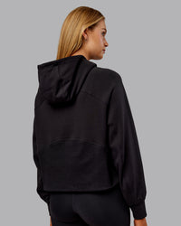 Woman wearing Pursue Mid-Weight Hoodie - Black | Model:Ella | Size:S | Thumbnail Index: 2
