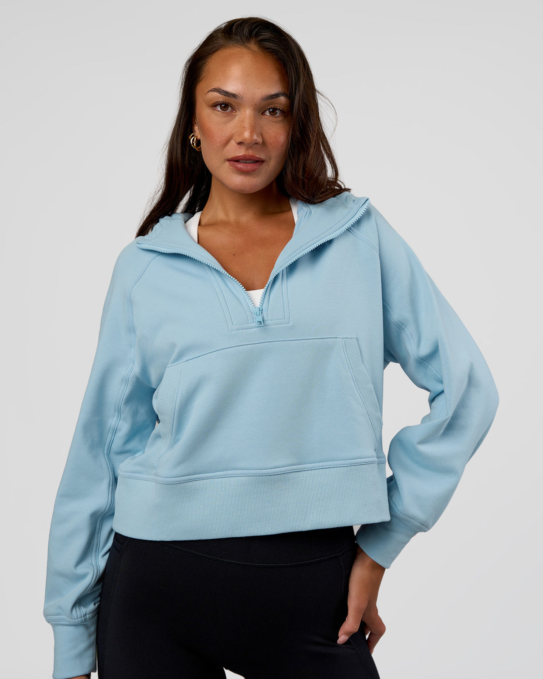 Woman wearing Pursue Mid-Weight Hoodie - Glacial Blue | Model:Kirstyn | Size:S - view 3