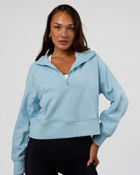 Woman wearing Pursue Mid-Weight Hoodie - Glacial Blue | Model:Kirstyn | Size:S | Thumbnail Index: 2