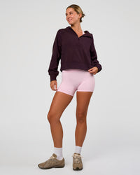 Woman wearing Pursue Mid-Weight Hoodie - Midnight Plum | Model:Amity | Size:S | Thumbnail Index: 2