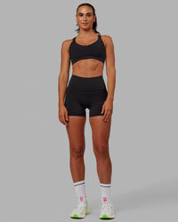 Woman wearing Push The Limit Sports Bra - Black | Thumbnail Index: 3