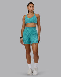 Woman wearing Push The Limit Sports Bra - Aquatic Awe Vitality Print | Thumbnail Index: 5